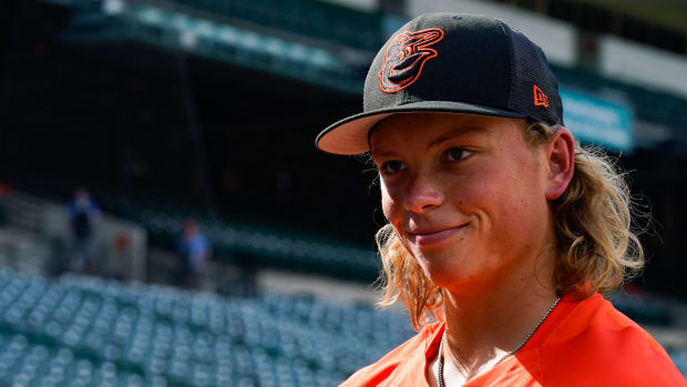 Jul 27, 2022; Baltimore, Maryland, USA; Baltimore Orioles number one draft pick Jackson Holliday stands on the field during the batting practice before the game against the Tampa Bay Rays at Oriole Park at Camden Yards. Holliday was the number one over draft pick in the 2022 MLB Draft. Mandatory Credit: Tommy Gilligan-USA TODAY Sports