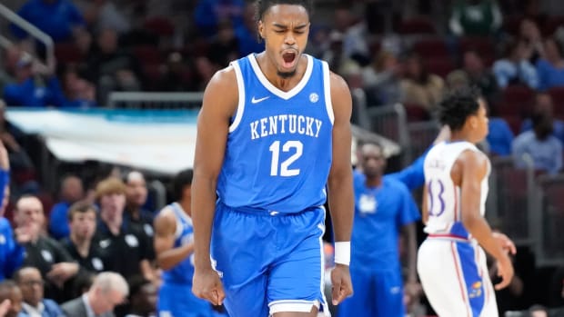 Nov 14, 2023; Chicago, Illinois, USA; Kentucky Wildcats guard Antonio Reeves (12) reacts after scoring against the Kansas Jayhawks during the second half at United Center. Mandatory Credit: David Banks-USA TODAY Sports