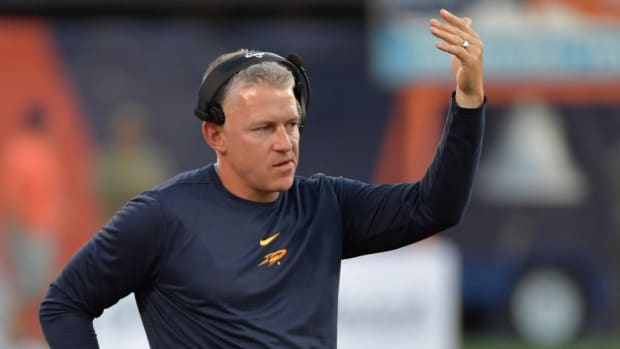Sep 2, 2023; Champaign, Illinois, USA; Toledo Rockets head coach Jason Candle directs his players during the first half against the Illinois Fighting Illini at Memorial Stadium.