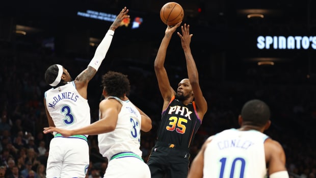 Nov 15, 2023; Phoenix, Arizona, USA; Phoenix Suns forward Kevin Durant (35) shoots the ball against the Minnesota Timberwolves in the first half at Footprint Center.