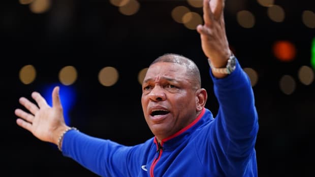 Former 76ers coach Doc Rivers reacts to a call.