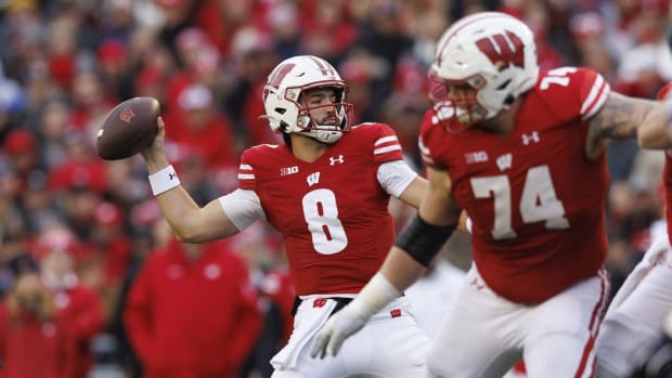 Nov 11, 2023; Madison, Wisconsin, USA; Wisconsin Badgers quarterback Tanner Mordecai (8) throws a pass during the second quarter against the Northwestern Wildcats at Camp Randall Stadium. Mandatory Credit: Jeff Hanisch-USA TODAY Sports