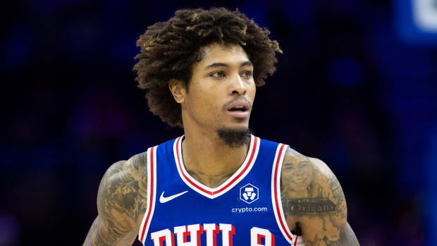 76ers guard Kelly Oubre Jr. dribbles with the ball during a game.