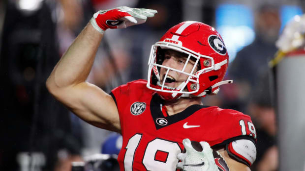 Georgia tight end Brock Bowers (19) celebrates after scoring a touchdown during the second half of a NCAA college football game against Ole Miss in Athens, Ga., on Saturday, Nov. 11, 2023. Georgia won 52-17.  