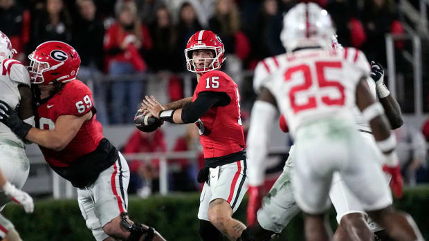 Georgia quarterback Carson Beck (15) throws from the pocket during the first half of a game against Ole Miss.