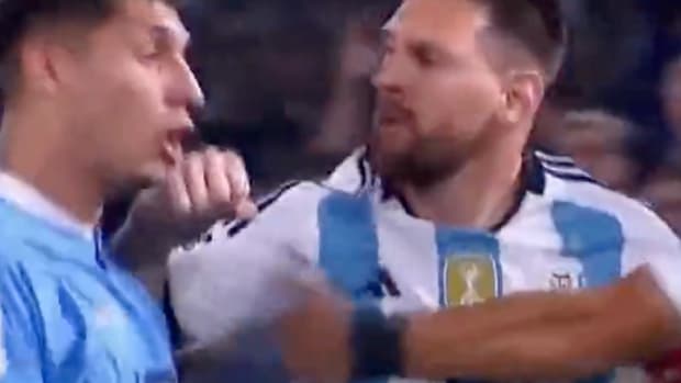 Lionel Messi pictured (right) striking Mathias Olivera during a game between Argentina and Uruguay in November 2023