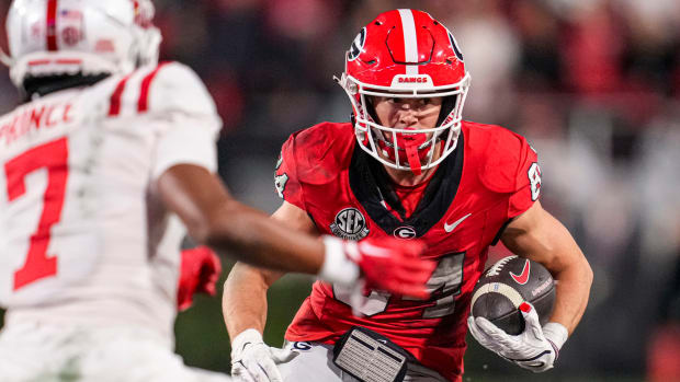 Georgia receiver Ladd McConkey carries the football after a catch during a game against Ole Miss.
