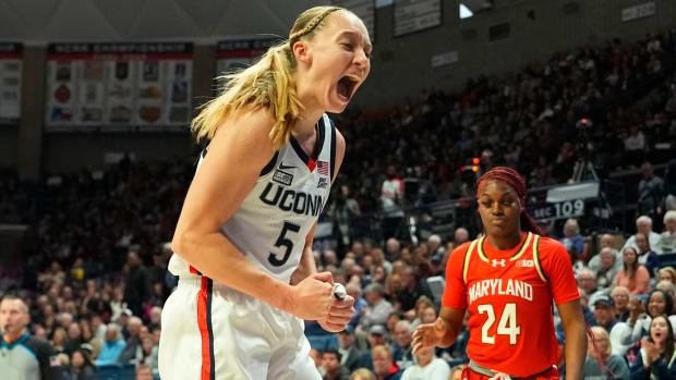 UConn guard Paige Bueckers yells after blocking a shot during a game against Maryland.