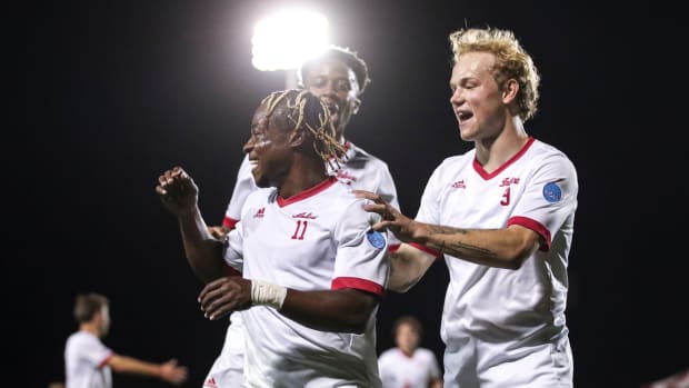 Nov. 16, 2023. Indiana freshman Collins Oduro (11) celebrates with teammates Sam Sarver and Maouloune Goumballe. Oduro and Goumballe scored in the team's 2-1 NCAA Tournament win over Lipscomb.
