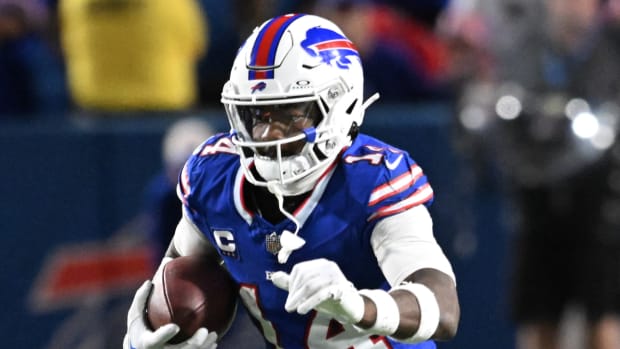 Bills receiver Stefon Diggs runs with the ball during a game.