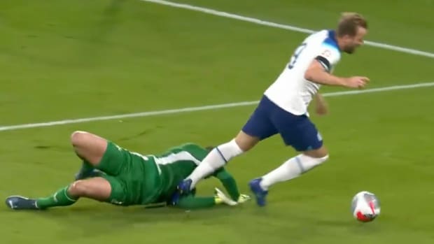 England captain Harry Kane pictured (right) falling to the ground after dribbling around Malta goalkeeper Henry Bonello during a Euro 2024 qualifier at Wembley in November 2023