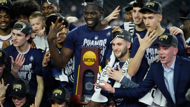 Apr 3, 2023; Houston, TX, USA; Connecticut Huskies players celebrate after defeating the San Diego State Aztecs in the national championship game of the 2023 NCAA Tournament at NRG Stadium.