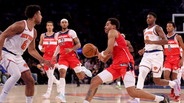 Oct 18, 2023; New York, New York, USA; Washington Wizards guard Jordan Poole (13) looks to pass the ball against New York Knicks guards Quentin Grimes (6) and RJ Barrett (9) during the third quarter at Madison Square Garden. Mandatory Credit: Brad Penner-USA TODAY Sports