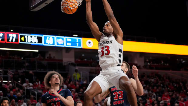 Cincinnati Bearcats forward Ody Oguama (33) dunks in the second half of the NCAA men s basketball exhibition game between the Cincinnati Bearcats and the Detroit Mercy Titans at Fifth Third Arena in Cincinnati on Friday, Nov. 10, 2023. The Bearcats won 93-61.