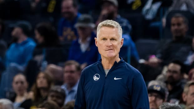 Nov 14, 2023; San Francisco, California, USA; Golden State Warriors head coach Steve Kerr watches a free throw by a Minnesota Timberwolves player during the first half at Chase Center.
