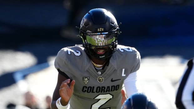Colorado Buffaloes quarterback Shedeur Sanders (2) at the line of scrimmage in the first half against the Arizona Wildcats at Folsom Field.