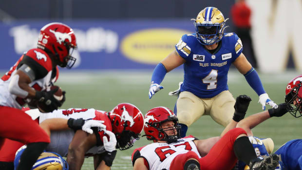 Aug 25, 2022; Winnipeg, Manitoba, CAN; Winnipeg Blue Bombers linebacker Adam Bighill (4) defends the line during the first half between against the Calgary Stampeders at IG Field. Mandatory Credit: Bruce Fedyck-USA TODAY Sports