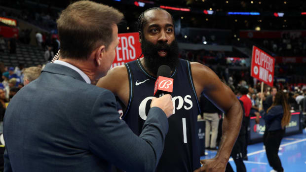 Clippers guard James Harden speaks with a Bally Sports reporter after a win over the Rockets.