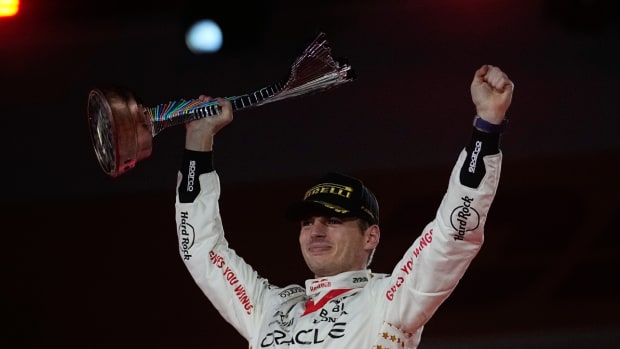 Red Bull driver Max Verstappen hoists up the Las Vegas Grand Prix trophy in 2023.