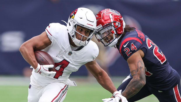 Arizona Cardinals wide receiver Rondale Moore (4) runs with the ball after a reception as Houston Texans cornerback Derek Stingley Jr. (24) defends during the first quarter at NRG Stadium.