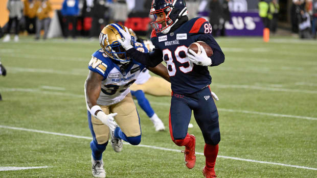 Nov 19, 2023; Hamilton, Ontario, CAN; Montreal Alouettes wide receiver James Letcher Jr. (89) tries to fend off a tackle from Winnipeg Blue Bombers linebacker Malik Clements (33) in the first half at Tim Hortons Field.