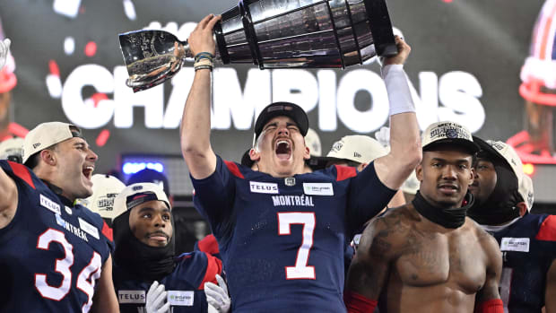 Nov 19, 2023; Hamilton, Ontario, CAN; Montreal Alouettes quarterback Cody Fajardo (7) lifts the Grey Cup trophy after the Alouettes defeated the Winnipeg Blue Bomber at Tim Hortons Field. Mandatory Credit: Dan Hamilton-USA TODAY Sports