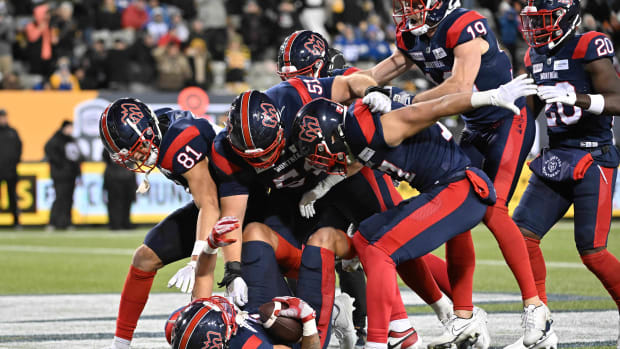 Nov 19, 2023; Hamilton, Ontario, CAN; Montreal Alouettes wide receiver Tyson Philpot (6) is mobbed by teammates after scoring the winning touchdown with 13 seconds left against the Winnipeg Blue Bombers at Tim Hortons Field. Mandatory Credit: Dan Hamilton-USA TODAY Sports