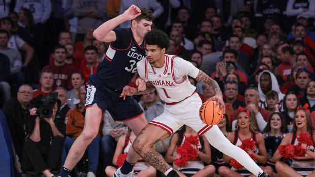 Indiana Hoosiers center Kel'el Ware (1) dribbles against Connecticut Huskies center Donovan Clingan (32) during the first half at Madison Square Garden. 