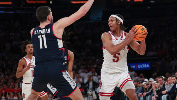 Indiana Hoosiers forward Malik Reneau (5) looks to pass as Connecticut Huskies forward Alex Karaban (11) defends during the second half at Madison Square Garden.