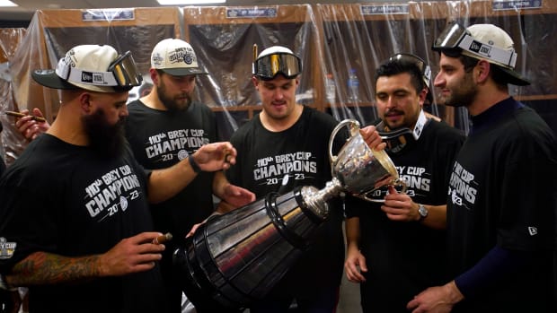 Nov 19, 2023; Hamilton, Ontario, CAN; Montreal Alouettes look at the Grey Cup after winning the 110th Grey Cup against the Winnipeg Blue Bombers at Tim Hortons Field. Mandatory Credit: John E. Sokolowski-USA TODAY Sports