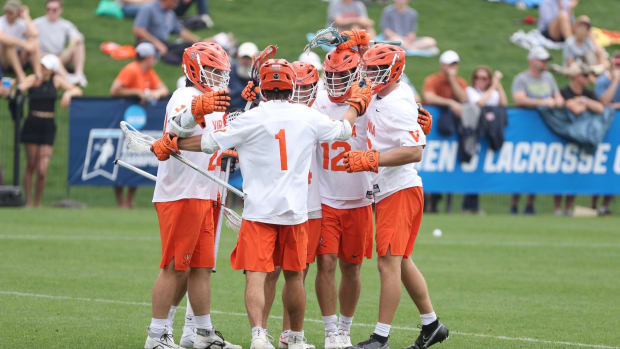 The Virginia men's lacrosse team celebrates after scoring a goal against Richmond in the first round of the NCAA Men's Lacrosse Championship at Klockner Stadium.