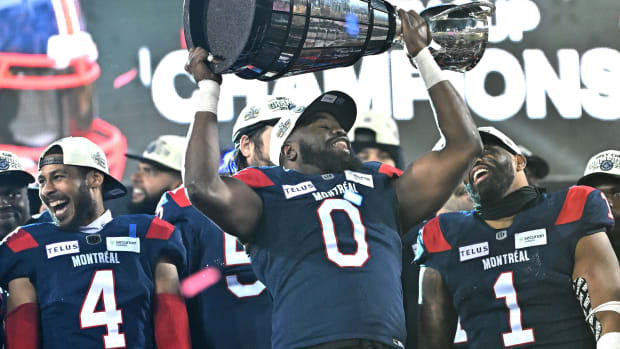 Nov 19, 2023; Hamilton, Ontario, CAN; Montreal Alouettes defensive lineman Shawn Lemon (0) holds up the Grey Cup trophy after defeating the Winnipeg Blue Bombers at Tim Hortons Field. Mandatory Credit: Dan Hamilton-USA TODAY Sports