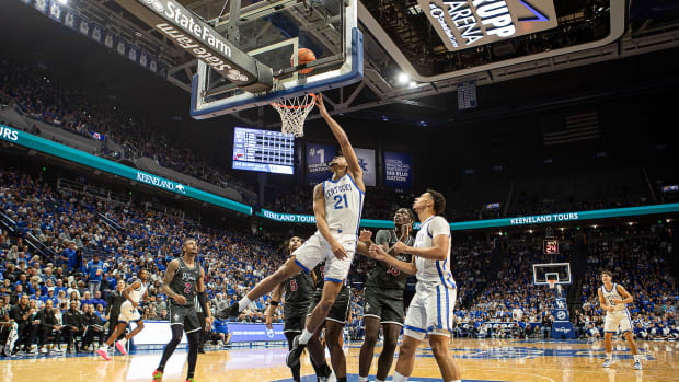 Kentucky's D.J. Wagner (21) scored the basket during first half action as the Wildcats took on the St. Joseph's Hawks at Rupp Arena on Monday, Nov. 20, 2023.