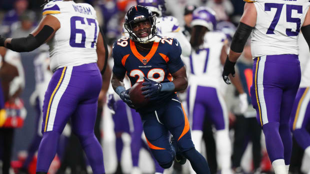 Denver Broncos cornerback Ja'Quan McMillian (29) reacts after recovering a fumble against the Minnesota Vikings in the first quarter at Empower Field at Mile High.