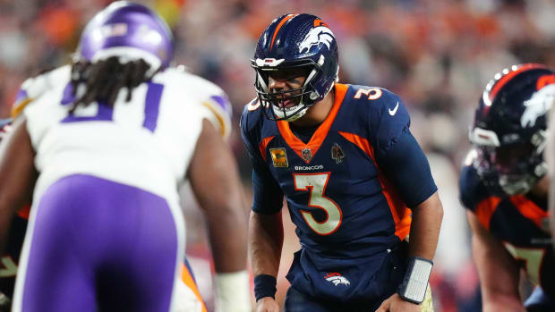 Denver Broncos quarterback Russell Wilson (3) reacts against the Minnesota Vikings in the fourth quarter at Empower Field at Mile High.