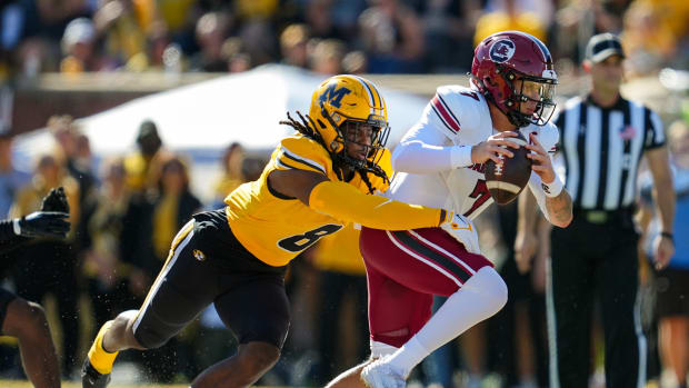 South Carolina Gamecocks quarterback Spencer Rattler (7) is tackled by Missouri Tigers linebacker Ty'Ron Hopper (8) during the first half at Faurot Field at Memorial Stadium. J