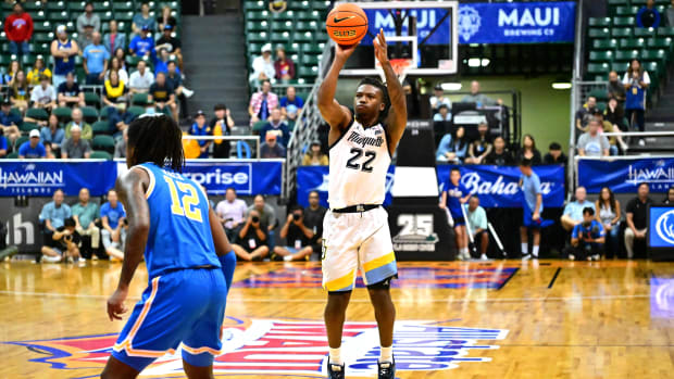 Nov 20, 2023; Honolulu, Hawaii, USA; Marquette Golden Eagles guard Sean Jones (22) shoots the game winning shot to defeat the UCLA Bruins at SimpliFi Arena at Stan Sheriff Center.