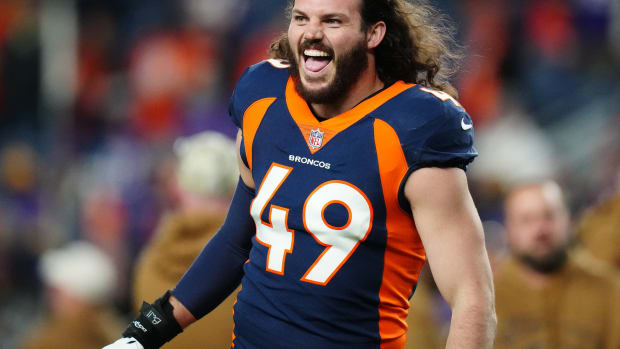 Nov 19, 2023; Denver, Colorado, USA; Denver Broncos linebacker Alex Singleton (49) reacts before the game against the Minnesota Vikings at Empower Field at Mile High. Mandatory Credit: Ron Chenoy-USA TODAY Sports