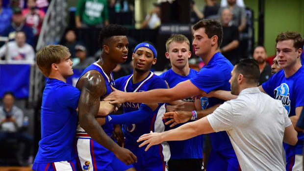 Nov 21, 2023; Honolulu, HI, USA; Players from Kansas Jayhawks and Marquette Golden Eagles became involved in a courtside disagreement during the first period at SimpliFi Arena at Stan Sheriff Center. Mandatory Credit: Steven Erler-USA TODAY Sports  