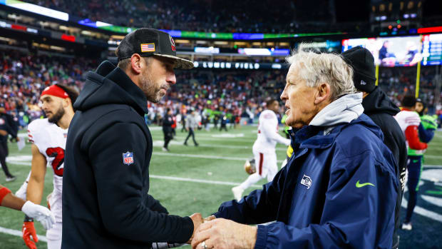 San Francisco 49ers head coach Kyle Shanahan, left, shakes hands with Seattle Seahawks head coach Pete Carroll following a 21-13 San Francisco victory at Lumen Field.