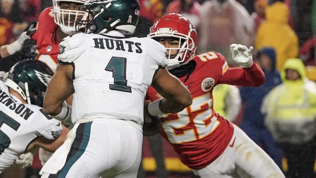 Trent McDuffie records a strip sack of Philadelphia Eagles quarterback Jalen Hurts