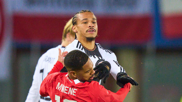 Leroy Sane pictured shoving Phillipp Mwene in the face during Germany's 2-0 loss to Austria in November 2023
