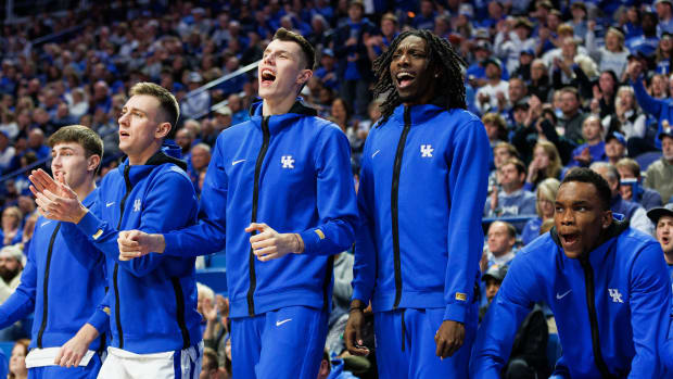 Nov 20, 2023; Lexington, Kentucky, USA; Kentucky Wildcats (from left to right) Brennan Canada, Zvonimir Ivisic, Aaron Bradshaw, and Ugonna Onyenso celebrate from the bench during the second half against the Saint Joseph's Hawks at Rupp Arena at Central Bank Center. Mandatory Credit: Jordan Prather-USA TODAY Sports