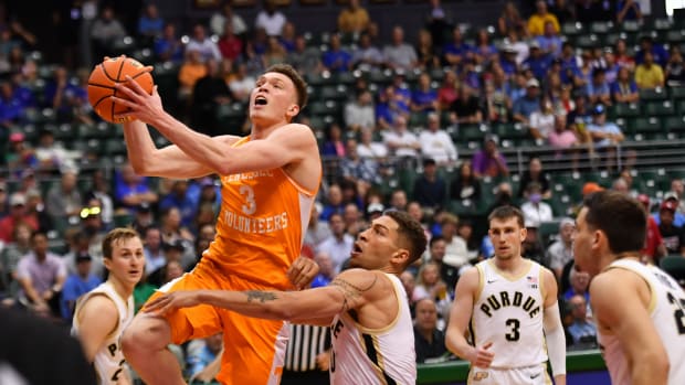 Nov 21, 2023; Honolulu, HI, USA; Tennessee Volunteers guard Dalton Knecht (3) drives to the basket past Purdue Boilermakers forward Mason Gillis (0) during the first period at SimpliFi Arena at Stan Sheriff Center. 