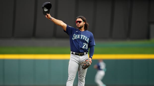 Seattle Mariners third baseman Eugenio Suarez (28) acknowledges the crowd before the first iinning of a baseball game between the Seattle Mariners and the Cincinnati Reds, Monday, Sept. 4, 2023, at Great American Ball Park in Cincinnati.