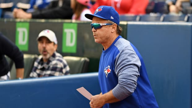 Sep 26, 2018; Toronto, Ontario, CAN; Toronto Blue Jays manager John Gibbons brings the lineup card to home plate at Rogers Centre for the last time as manager of the Toronto Blue Jays before the regular season MLB game between the Houston Astros and Toronto Blue Jays at Rogers Centre.
