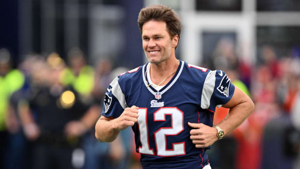 Sep 10, 2023; Foxborough, Massachusetts, USA; New England Patriots former quarterback Tom Brady runs on the field during a halftime ceremony in his honor during the game between the Philadelphia Eagles and New England Patriots at Gillette Stadium.