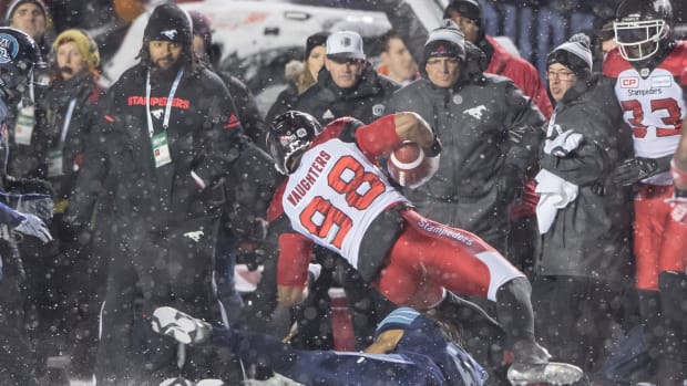 Nov 26, 2017; Ottawa, Ontario, CAN; Calgary Stampeders defensive line James Vaughters (98) is tackled byToronto Argonauts linebacker Marcus Ball (6) during the second half of the Grey Cup championship at TD Place Stadium. The Argonauts defeated the Stampeders 27-24 to win the Grey Cup. Mandatory Credit: Marc DesRosiers-USA TODAY Sports