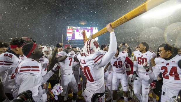 Nov 30, 2019; Minneapolis, MN, USA; Wisconsin Badgers punter Connor Allen (90) celebrates with the Paul Bunyan Axe Trophy after defeating the Minnesota Golden Gophers at TCF Bank Stadium. Mandatory Credit: Jesse Johnson-USA TODAY Sports