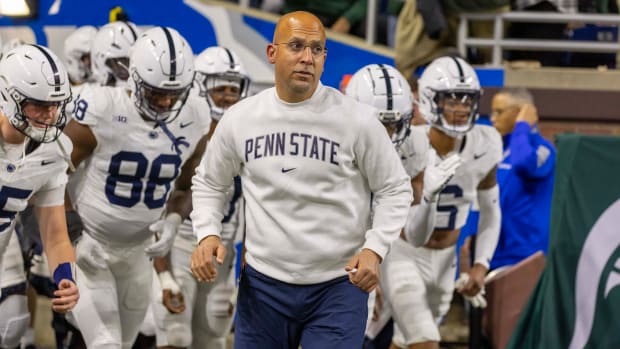 Penn State coach James Franklin leads the Nittany Lions onto the field to face the Michigan State Spartans.
